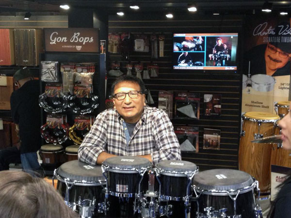 Photo of Alex Acuna with his Signature Drums at NAMM 2013